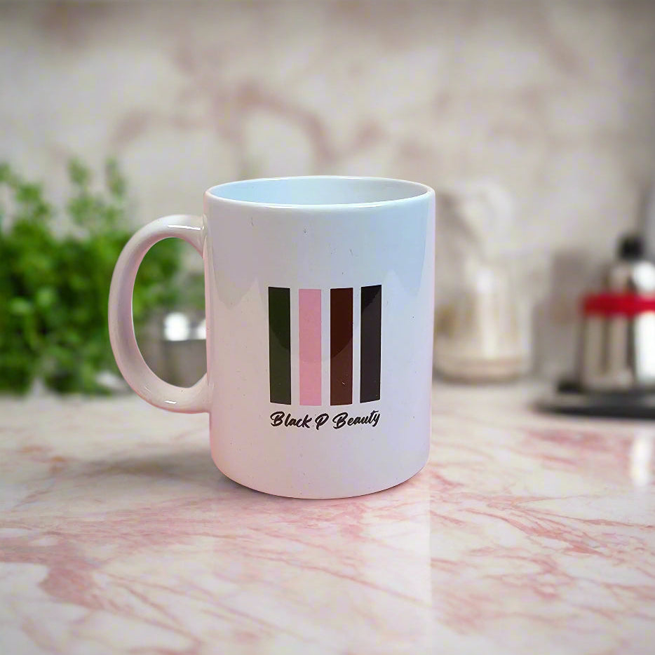 Black P Beauty branded coffee mug in a sleek design, perfect for sipping your favorite hot beverages while celebrating beauty, confidence, and self-care.