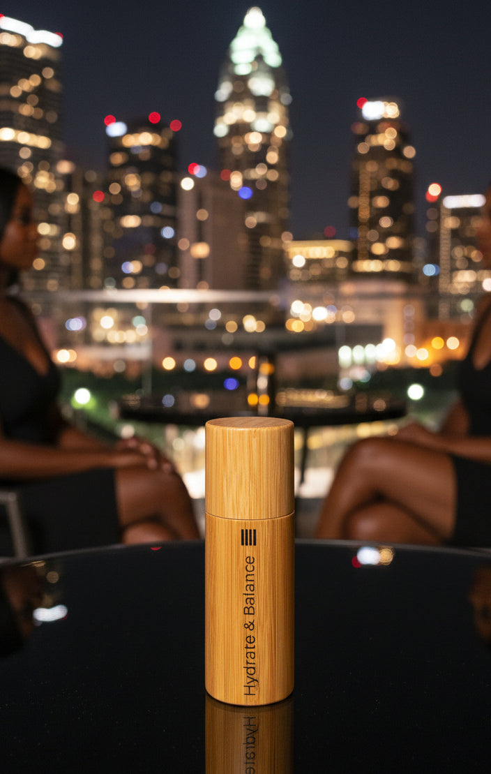 Bamboo bottle with 'Hydrate & Balance' branding on a white background