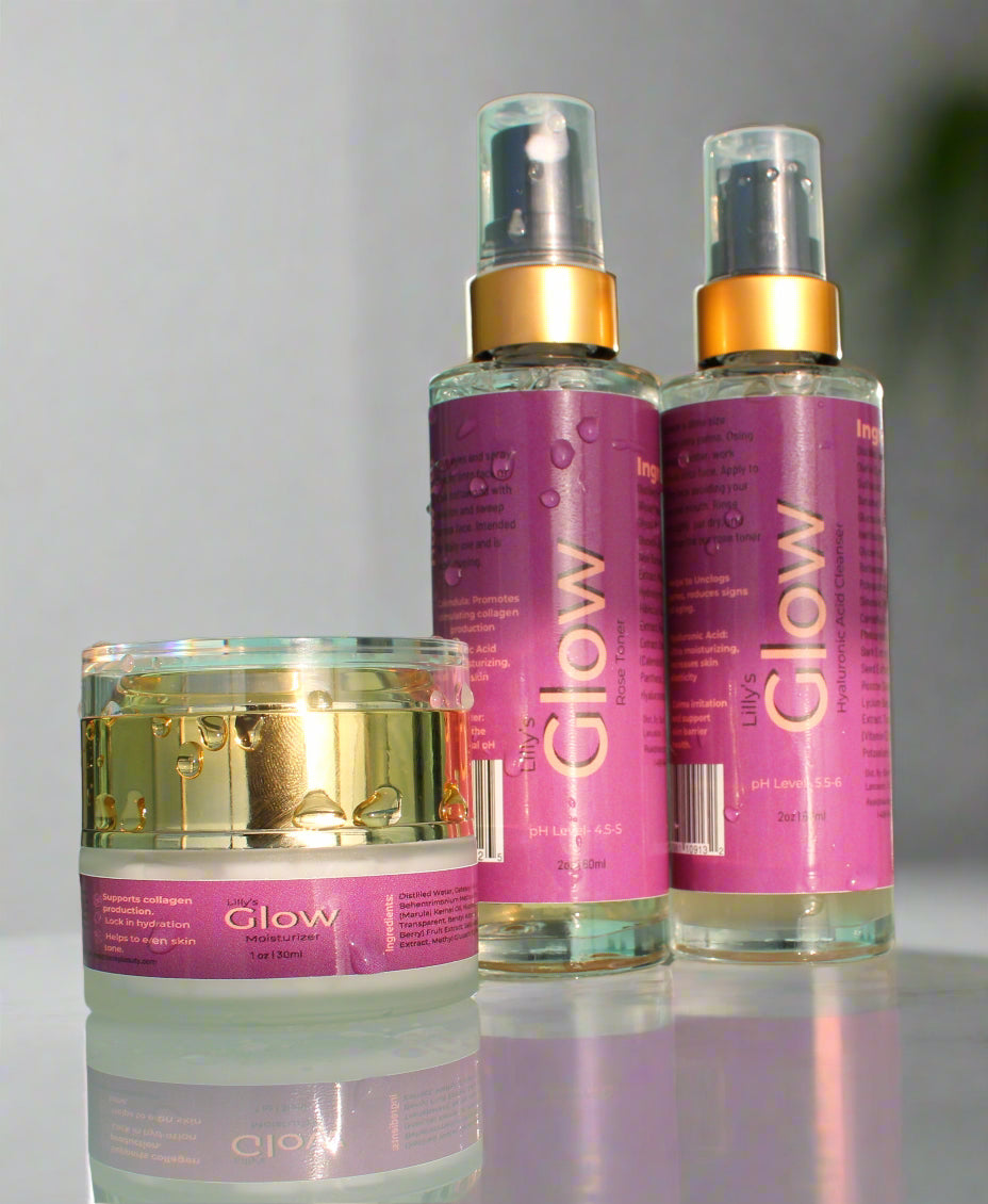 Cleanser, Toner, and Moisturizer in a glass bottle and jar with gold tops