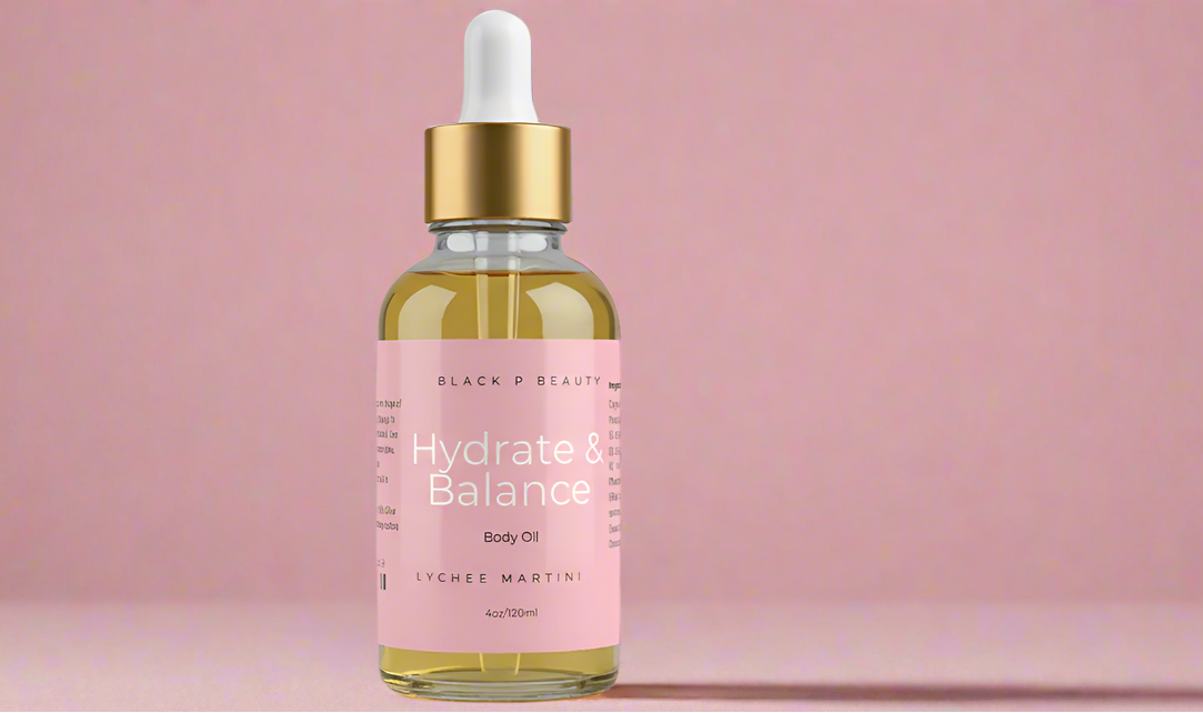 Bottle of body oil with gold dropper on a pink background